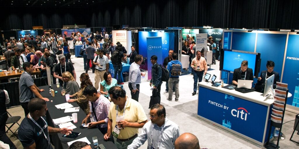 Exhibitors networking with attendees at the API World Conference