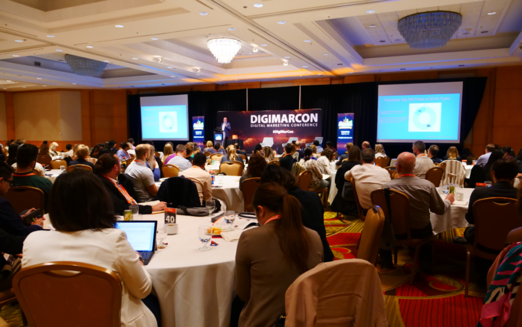 Speaker presenting to attendees at the TECHSPO conference