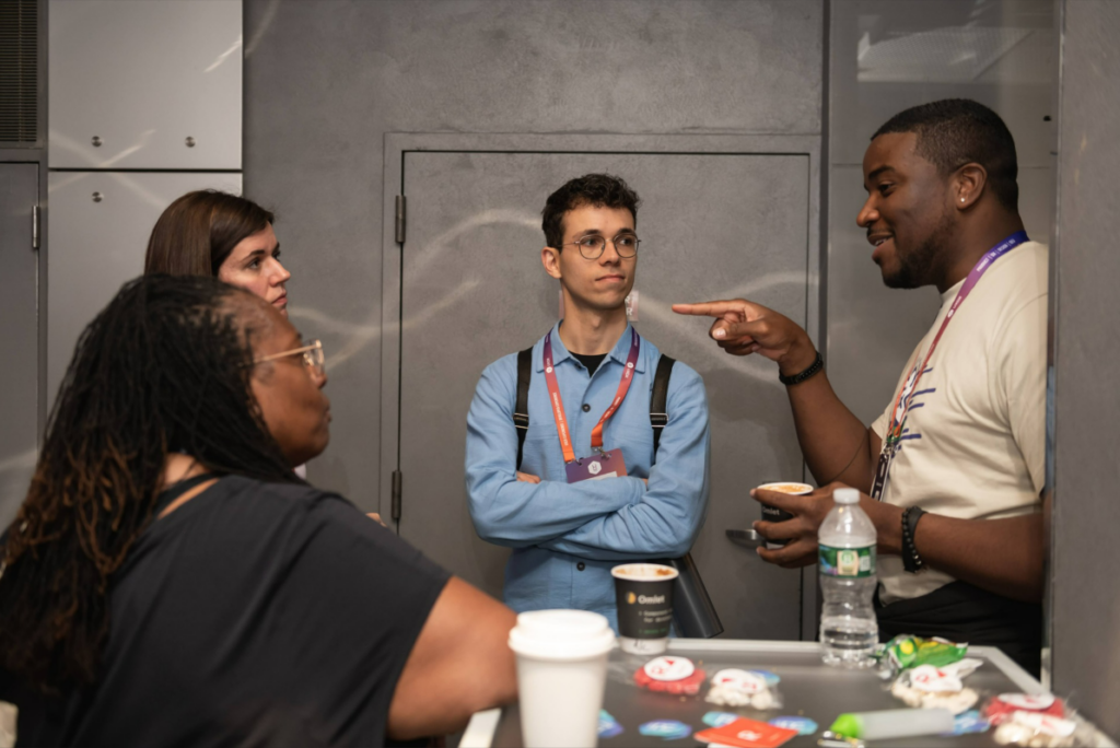 Attendees networking at the UXDX USA conference